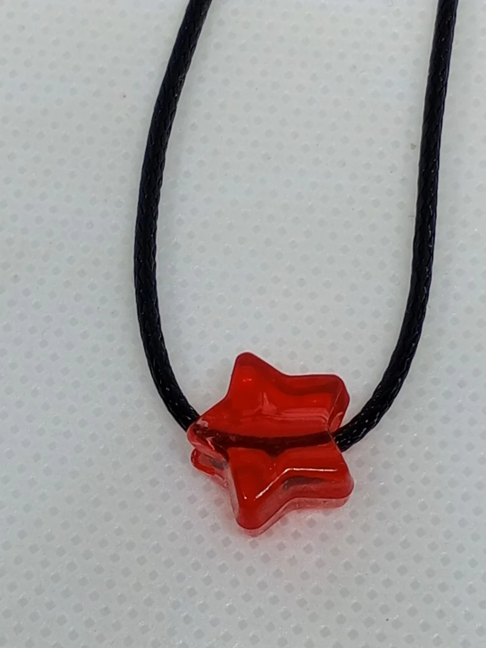Red Star Pendant Necklace on Black Cord